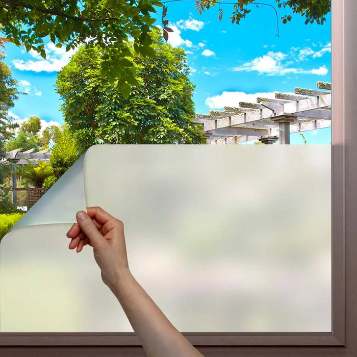 Static cling privacy window film being applied to residential glass